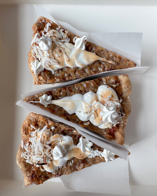 Chocolate coconut pecan chess pie styled overhead with toasted coconut pecan topping