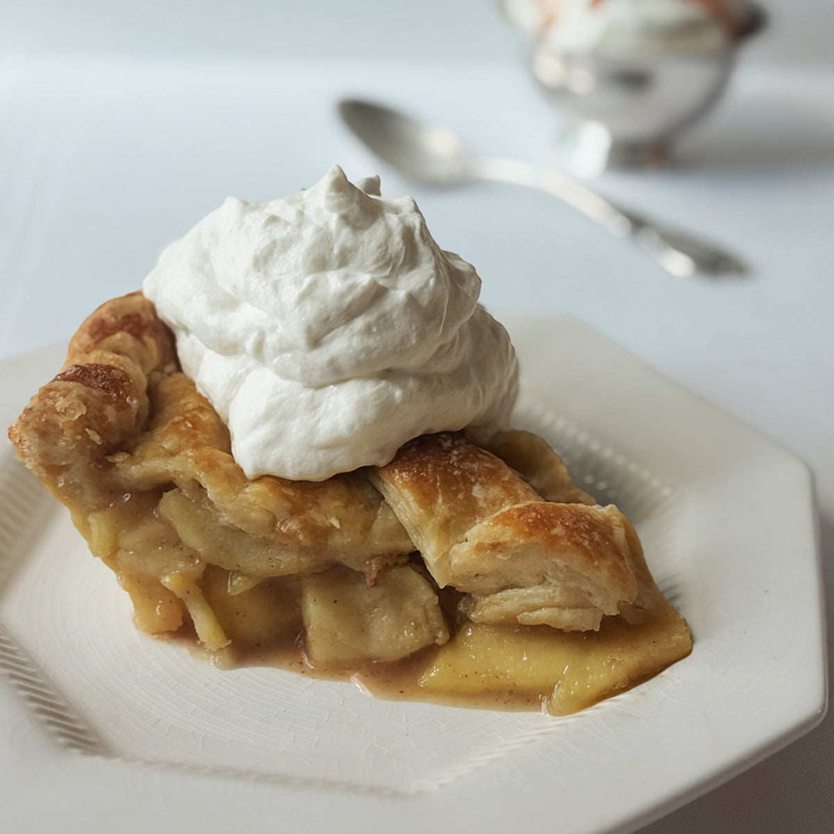 Slice of Salted Caramel Apple Pie with tender apples and all butter crust baked in Savannah Georgia