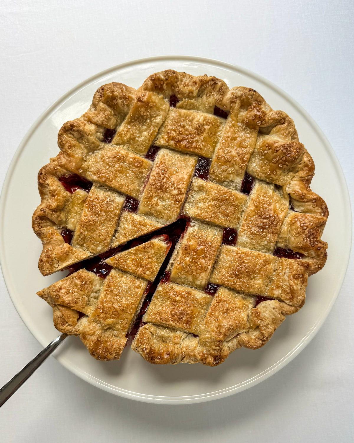 Tart cherry pie with lattice crust and slice removed