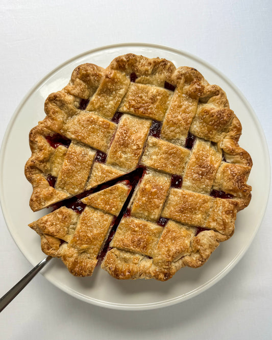 Tart cherry pie with lattice crust and slice removed