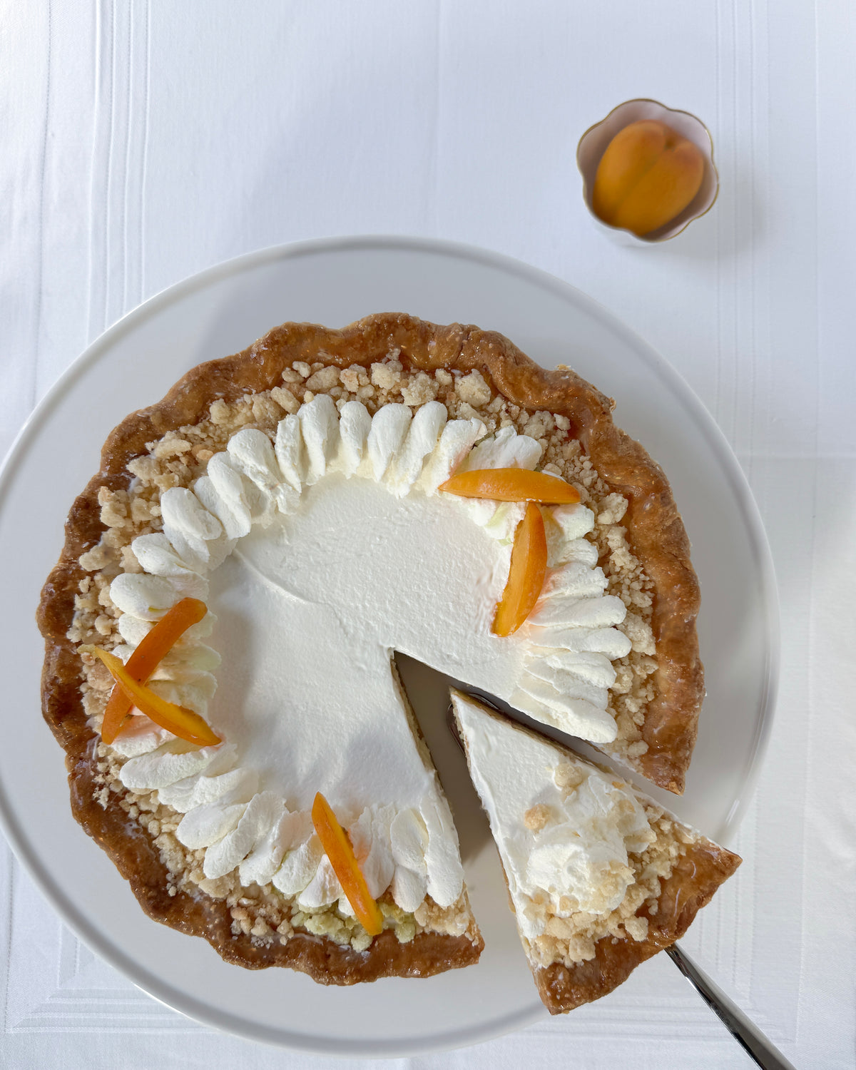 Buttermilk peach preserves pie with whipped cream and crumble topping by Sunday Crust Savannah Georgia